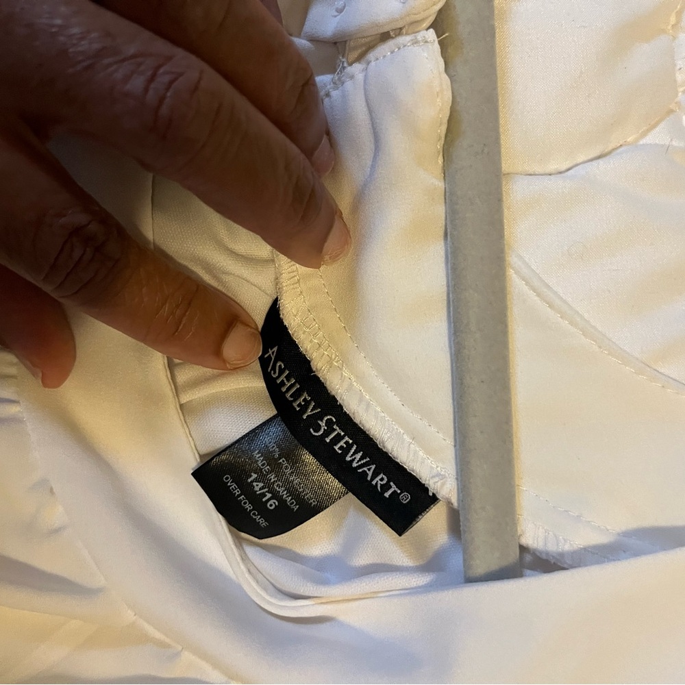 White dress with under slip. Sleeveless & very chic